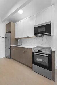 Modern 2BR w/ Rooftop, Elevator, Laundry & Parking in Wingate – No Fee!