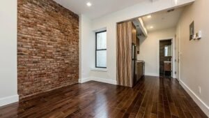 Renovated 2BR Bed-Stuy Gem: Exposed Brick, Backyard, Laundry, Prime Location!