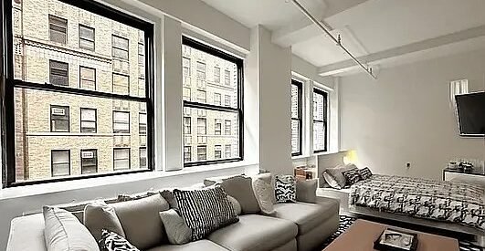 Elegant Midtown West Loft – Doorman, Laundry, Natural Light, Prime Location